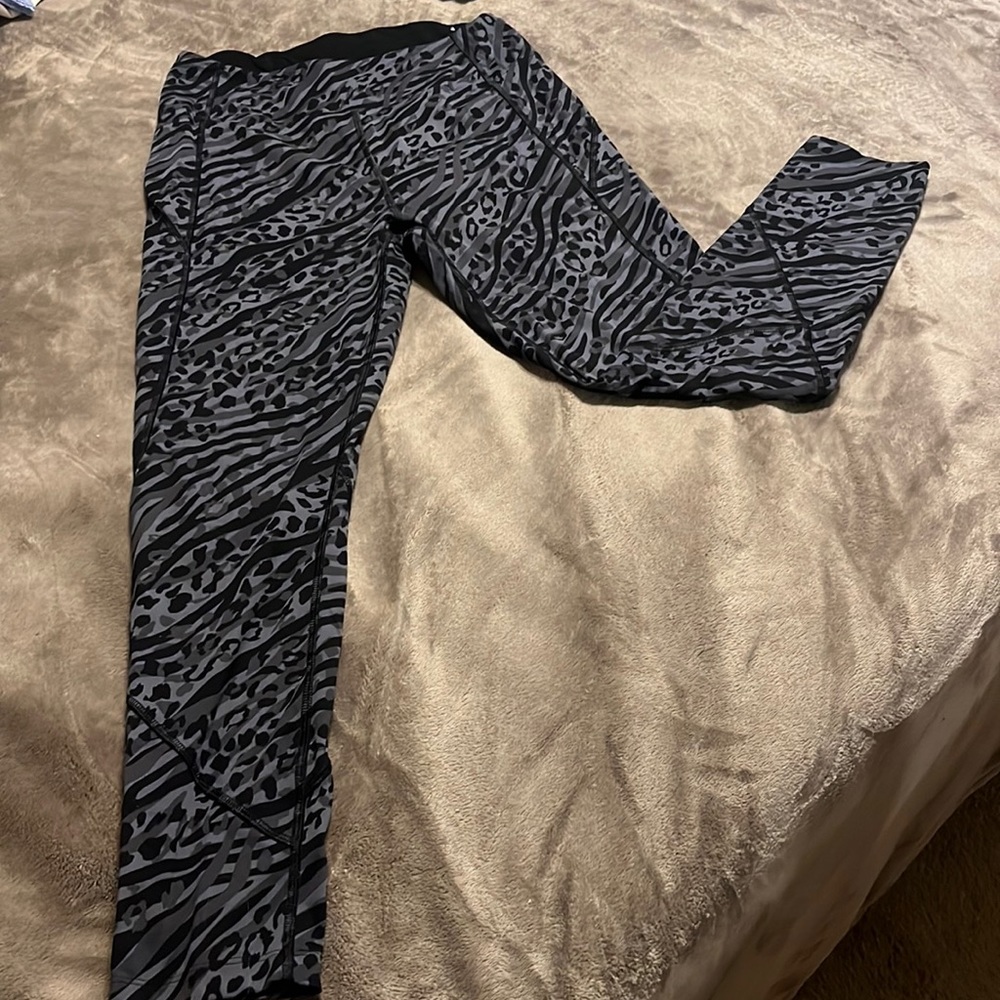 Women’s pink sport leggings - mixed animal print. Size medium
